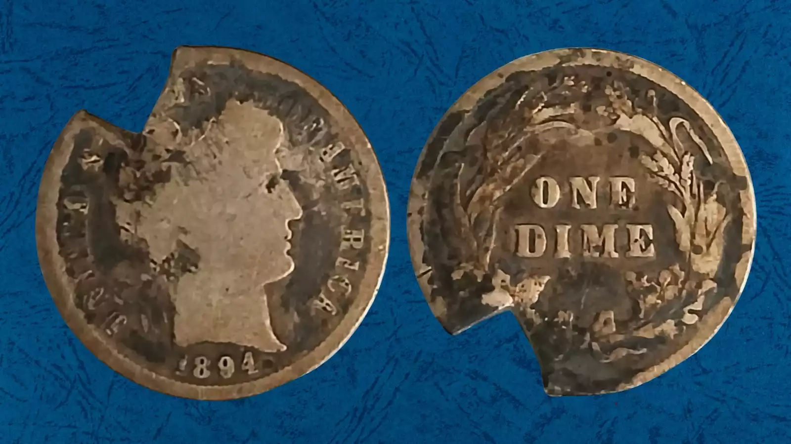 1894 Barber dime clipped planchet error showing curved section missing from the edge